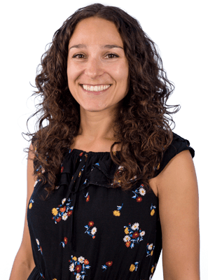 Friendly looking customer service woman pictured from the waist up