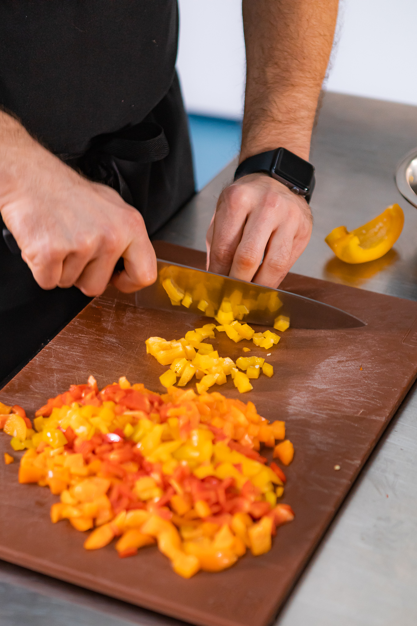 A chef frying food in a wok