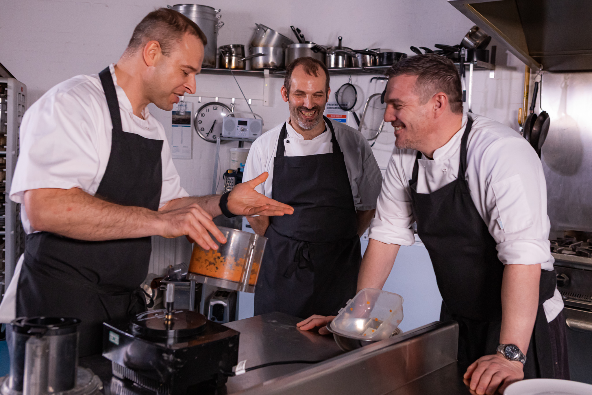 A chef frying food in a wok